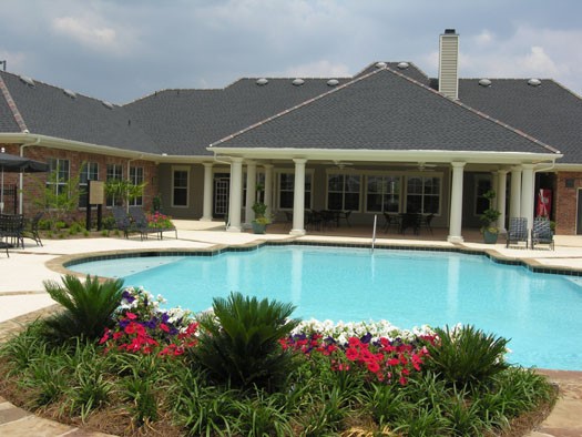 Westlake Apartments full view of pool with beautiful greenery